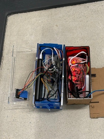 Open blaster and vest showing breadboards and wiring